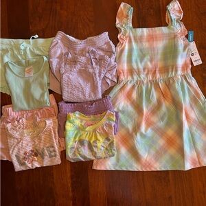 A variety of children’s clothes included 1 dress and 4 short sets 5T